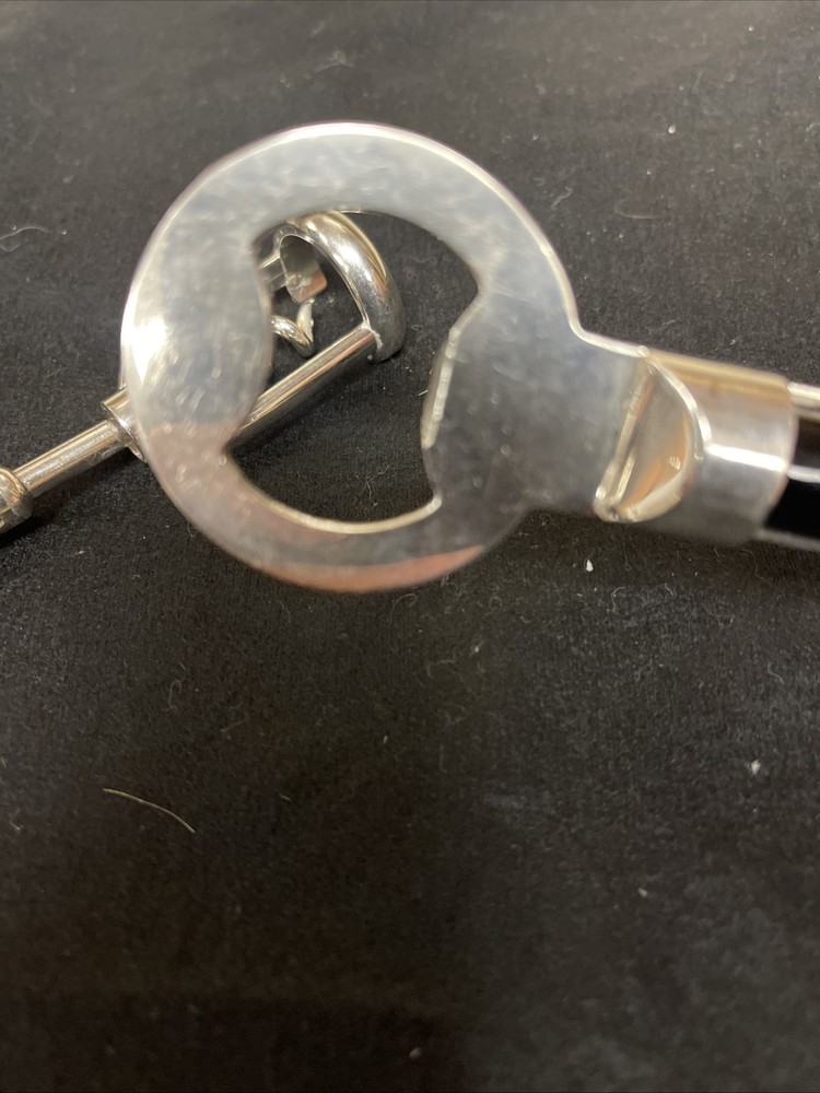 Silver corkscrew and bottle opener with blown glass insert