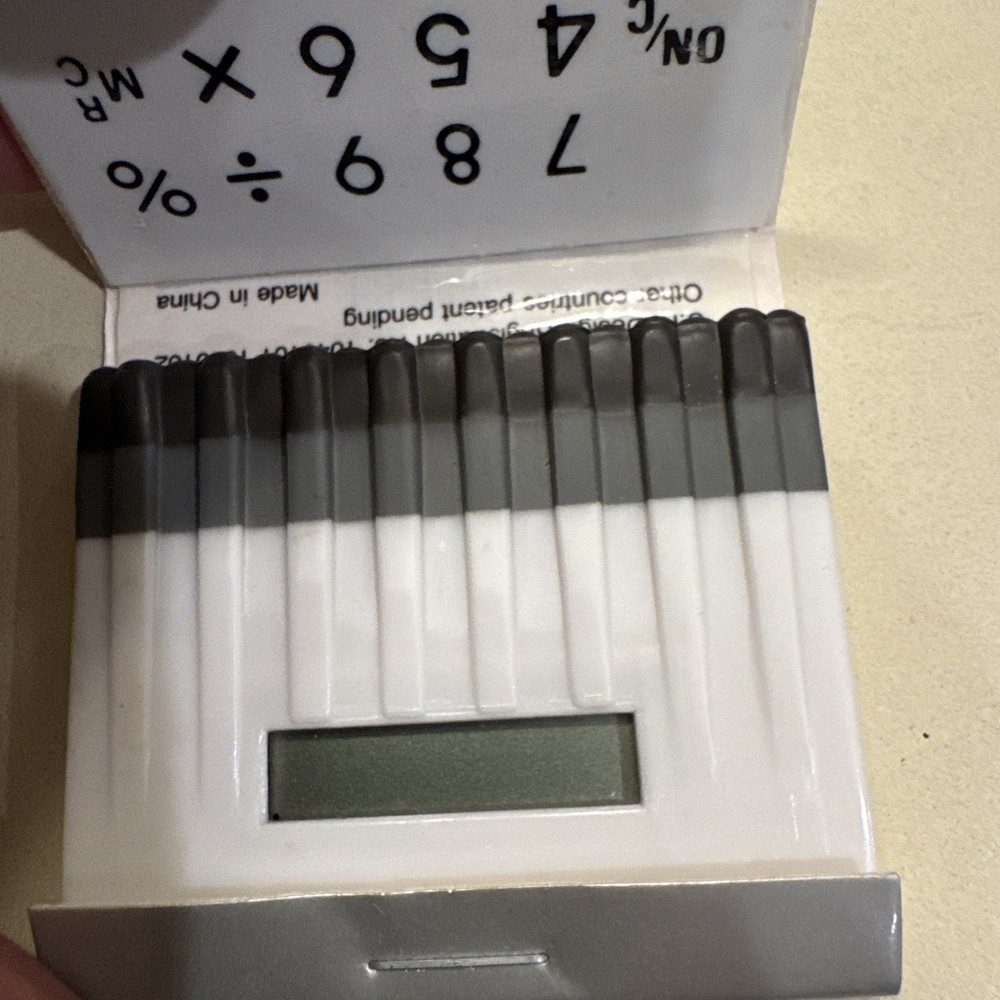 Neiman Marcus Calculator Shaped like Matchbook - silver, does not work