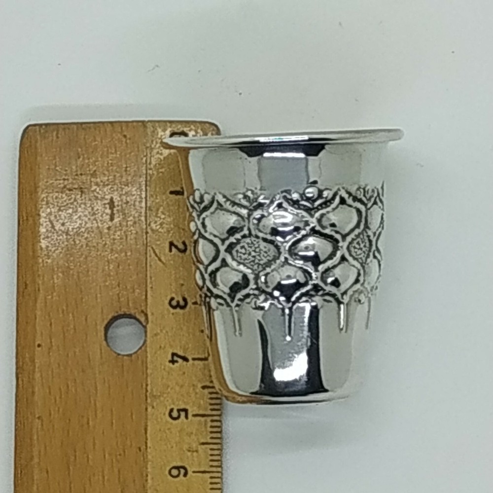Handmade sterling silver liquor cup with embossed design