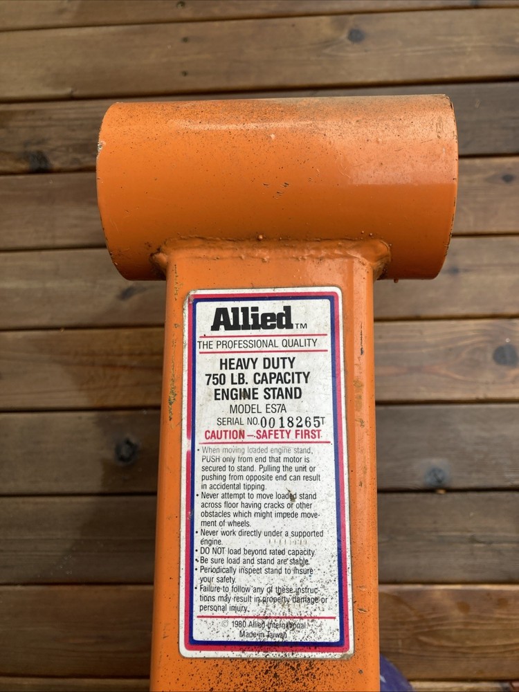 Engine Rebuild Stand Modified for Greater Stability with additional Wheels.