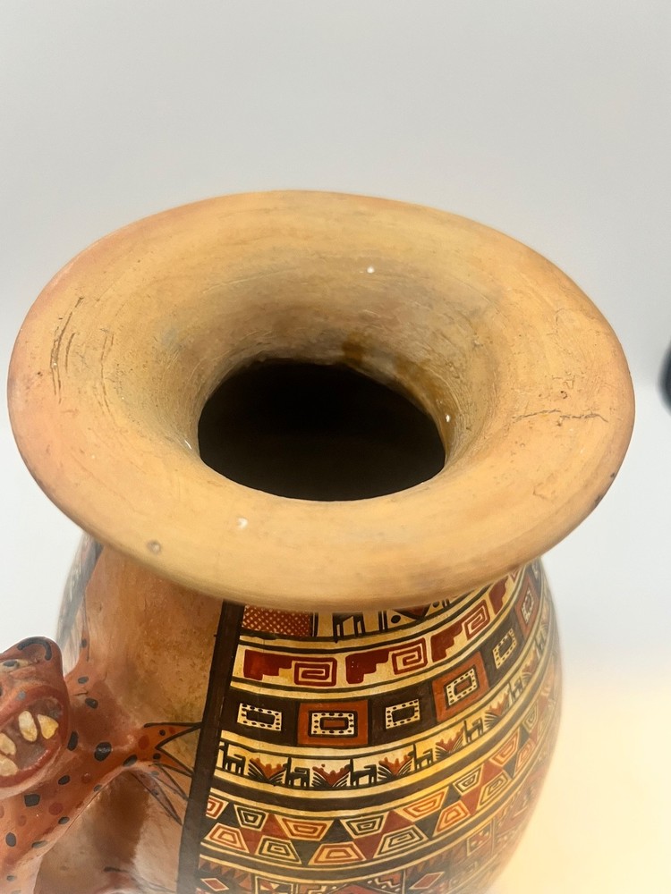 Peruvian ceramic stirrup vase with Jaguar handles and geometric designs