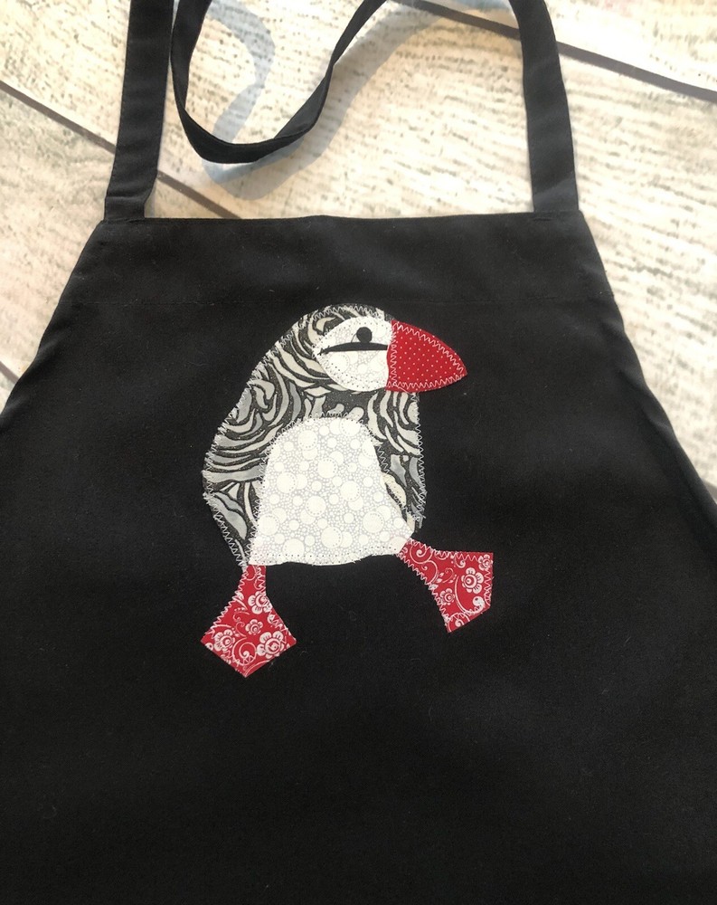 Apron With appliqué puffin.