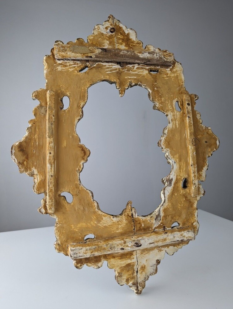 Antique gilt stuccoed wood frame