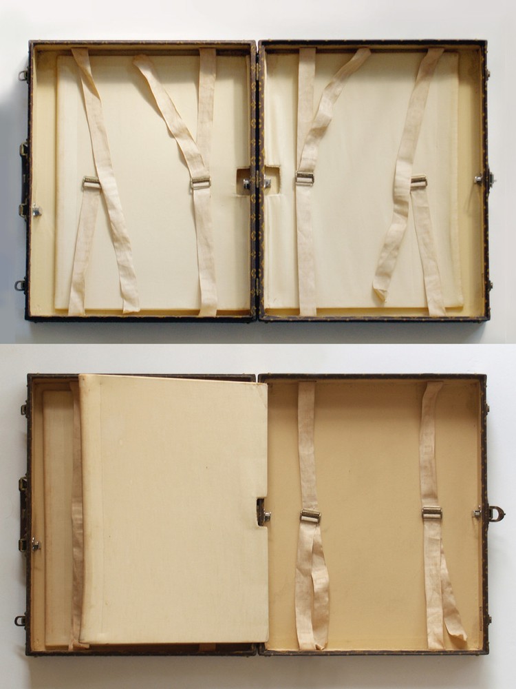 Louis Vuitton monogram suitcase trunk open by center, square handle.