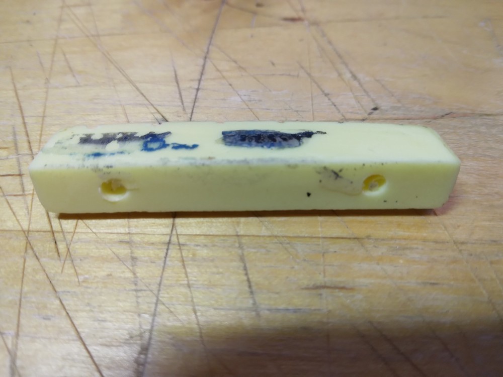 Vintage unbranded Plastic guitar Nut, white