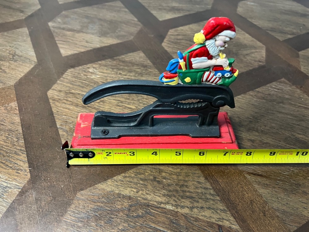 Old Fashioned Nutcracker Cast Iron on Wood Base santa theme nutcracker vintage