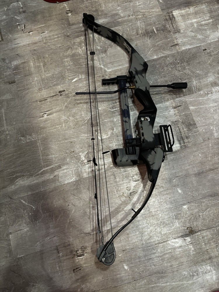 This item is a PSE Polaris Express bow riser, featuring a camouflage design.