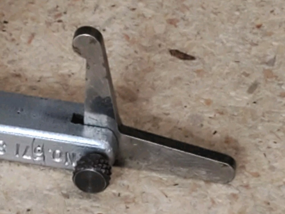 Starrett No. 671 - universal attachment for dial indicators with two arms