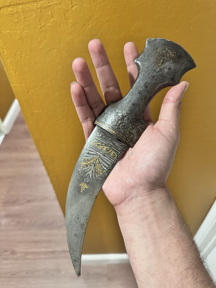 antique dagger with gold and silver engravings