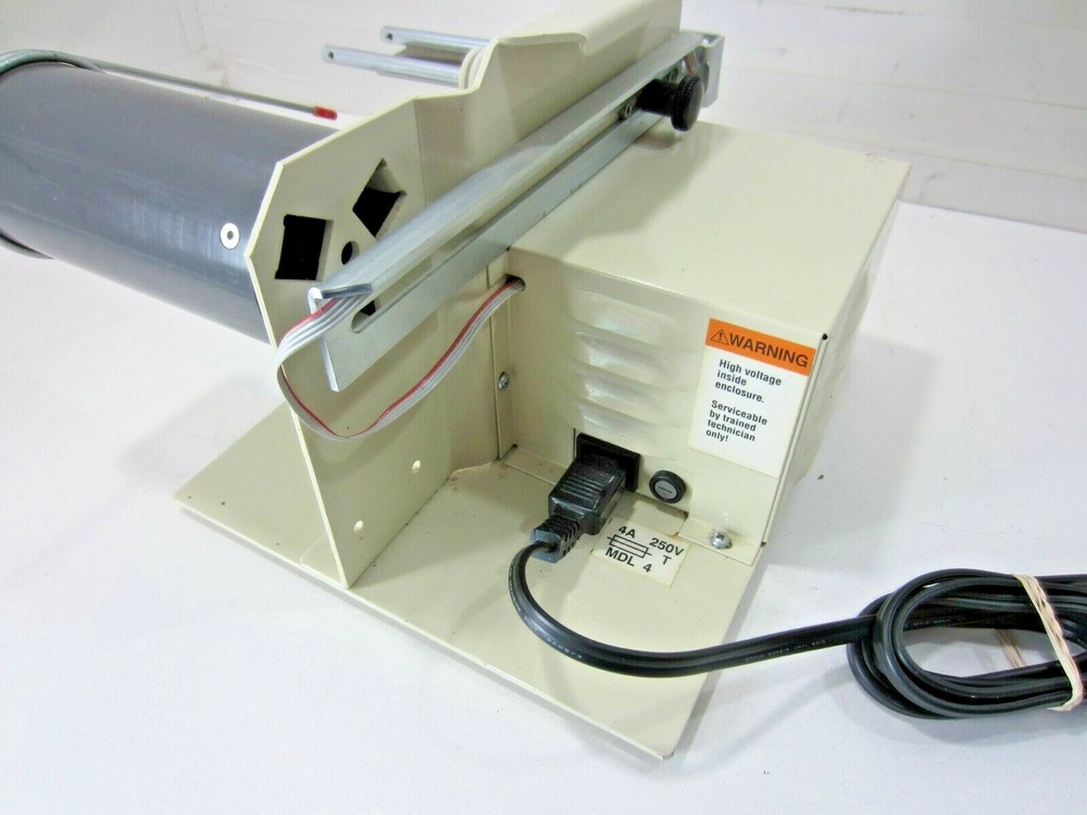Grip-A-Tab Electric Tape Dispenser Machine