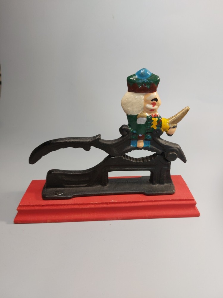 Cast Iron Painted Soldier Nut Cracker on wood base