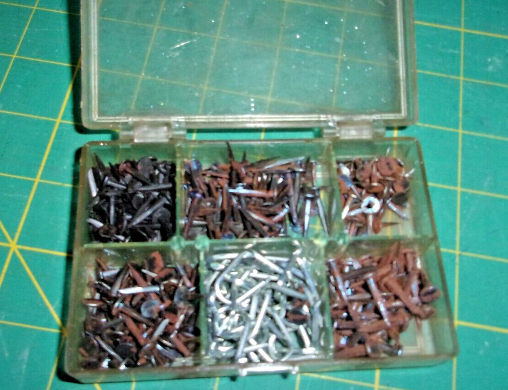 Furniture tacks in storage box