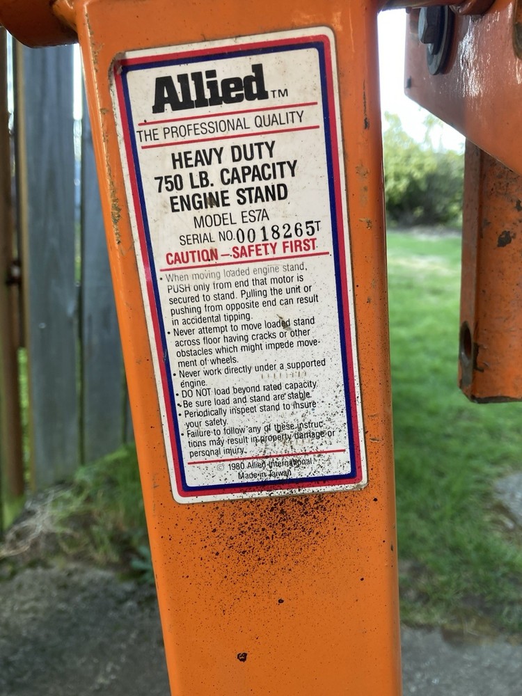 Engine Rebuild Stand Modified for Greater Stability with additional Wheels.