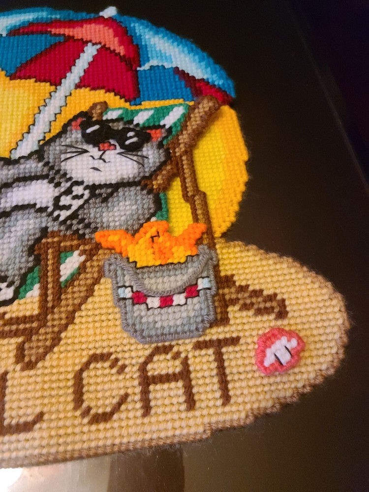 Cross stitch cat at beach on plastic canvas. 3D.