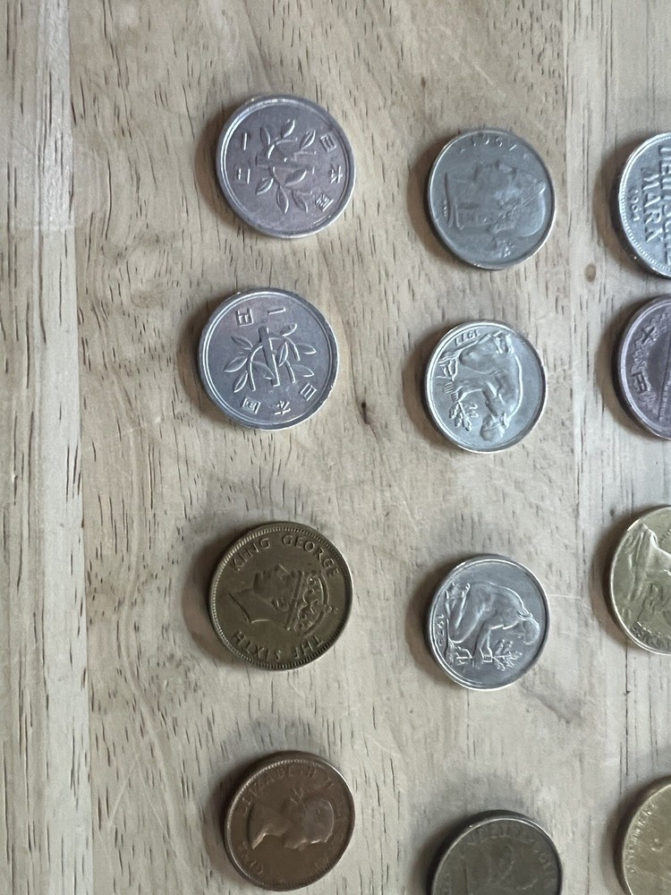 Assorted foreign coins. 26 Coins In Total