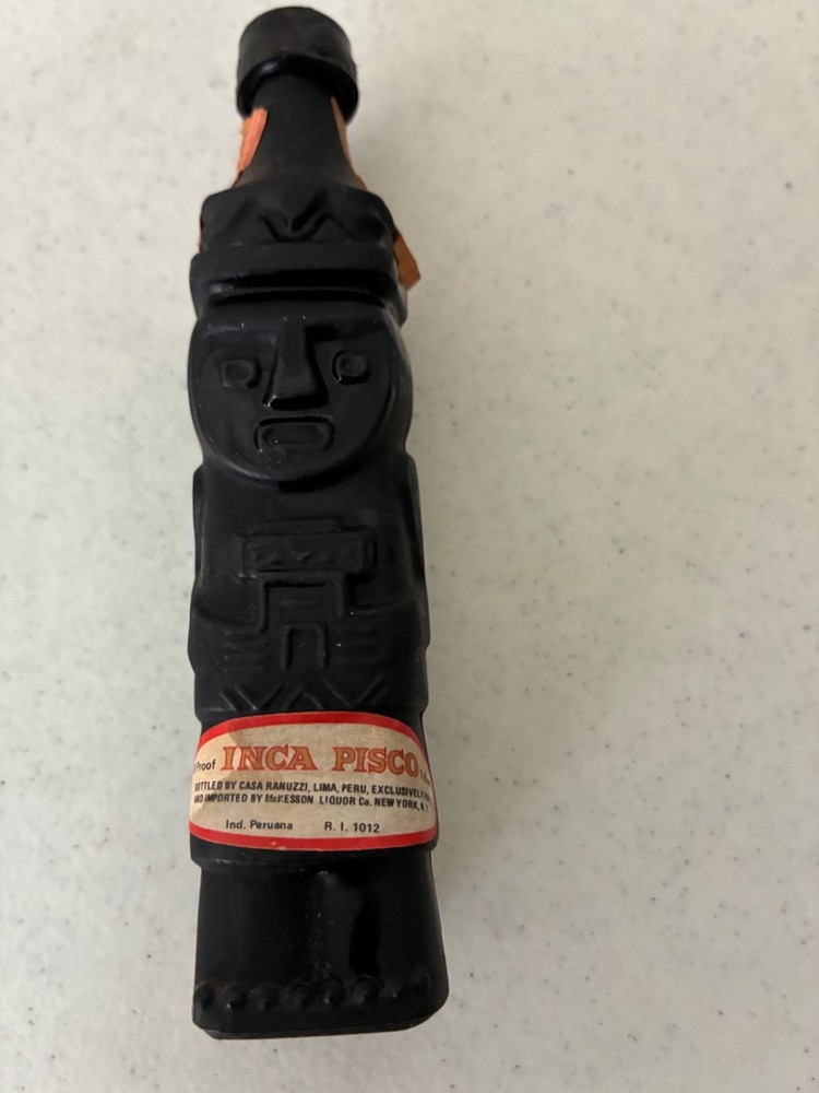 Two Empty Inca Pisco Bottles