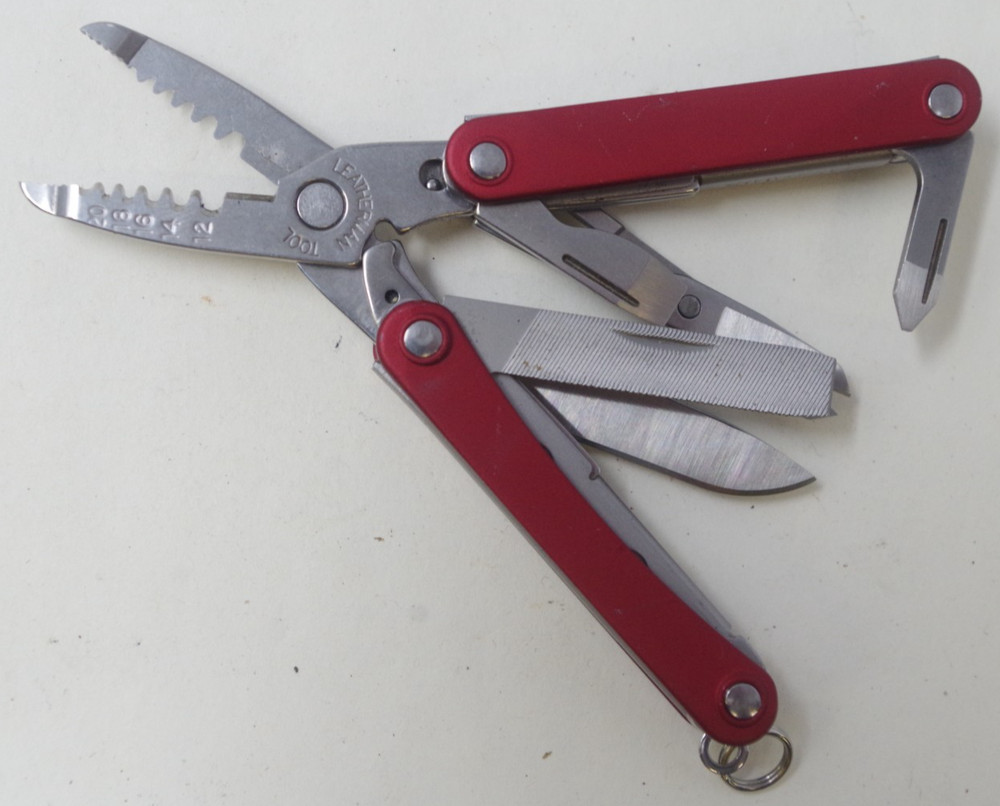 Retired Red Leatherman Squirt ES4 Multi-Tool Pocket Knife - TSA Auction