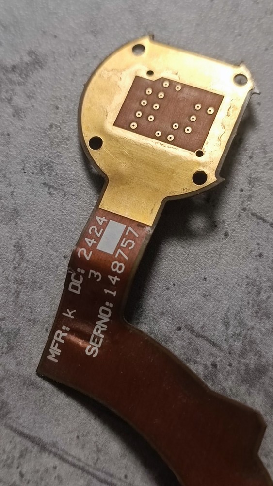 Flexible printed circuit board with integrated sealed electronic module.