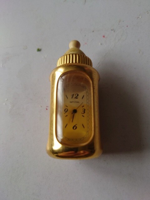 Miniature Clock Baby Bottle.