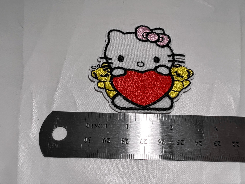 Hello Kitty Holding a Heart Iron on Patch