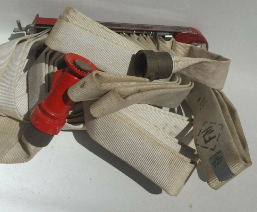F-M Fireman Hose Rack with Fire Hose.