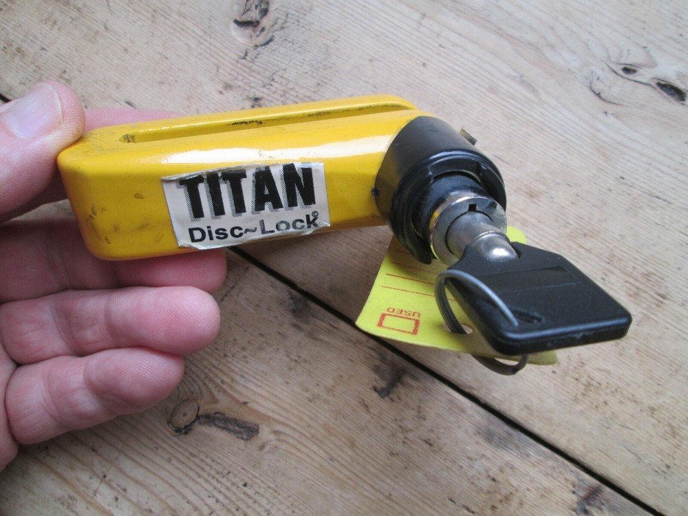 MOTORCYCLE DISC LOCK USED - TITAN YELLOW DISC LOCK
