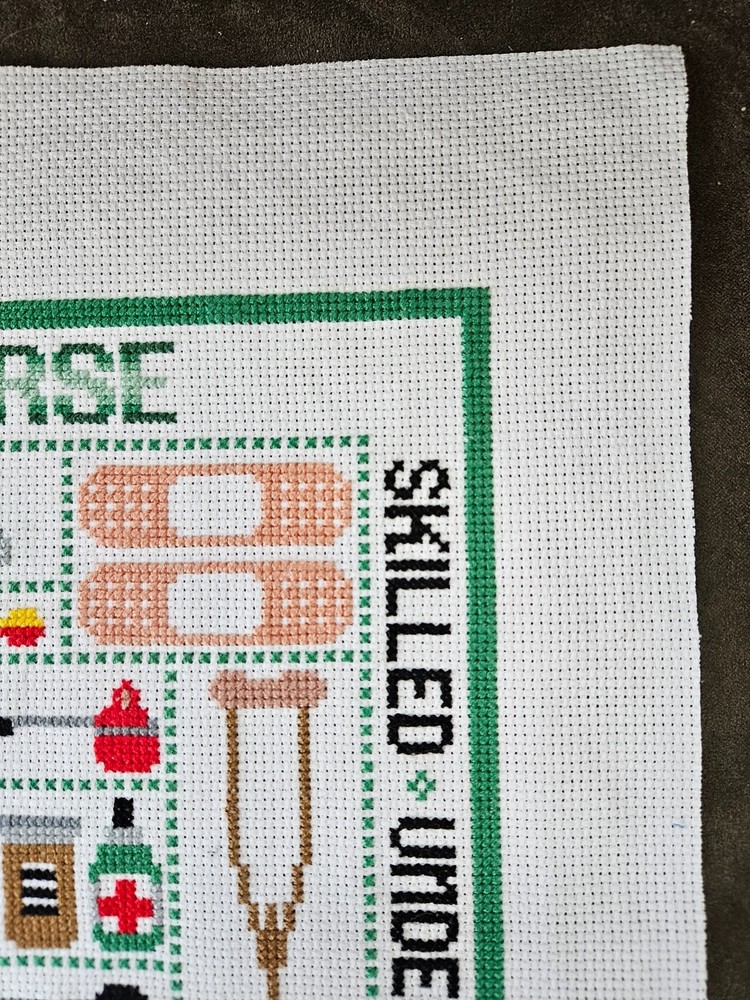 cross stitch completed finished hand made- Nurse sampler-unframed