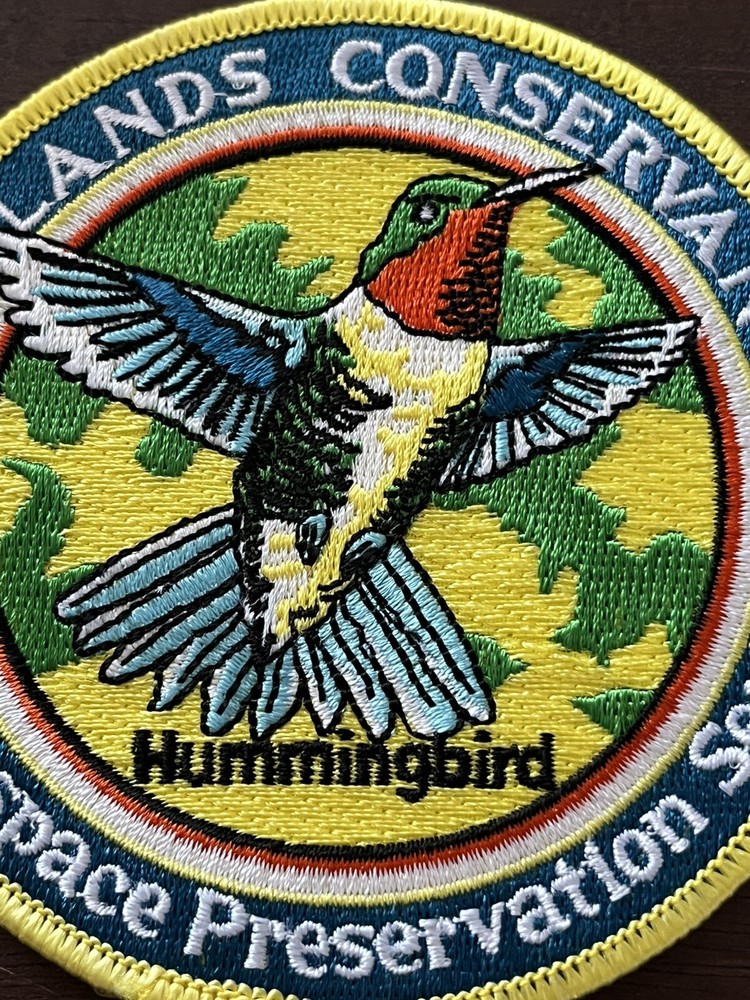 2004 WILDLANDS CONSERVANCY PATCH 4" DIA “HUMMINGBIRD”