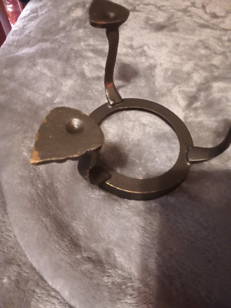 Brushed silver ball,or orb on painted brass base.