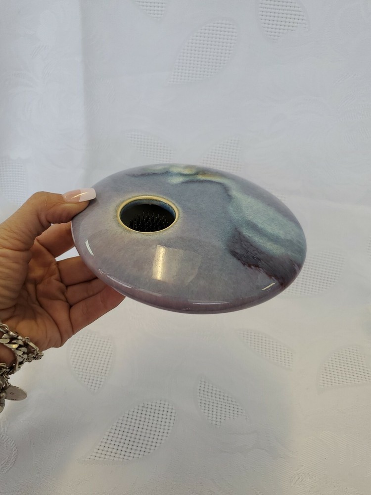 Ceramic single flower bud display vase.