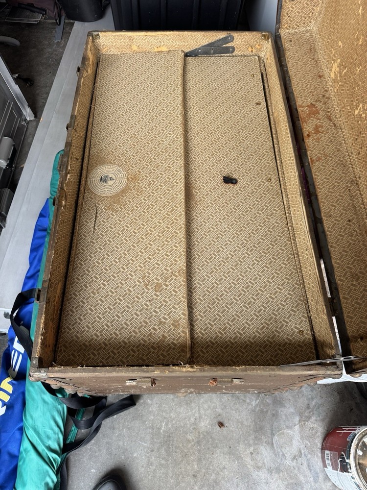 Antique Trunk With Roller Wheels and Leather Straps with the Original Inserts