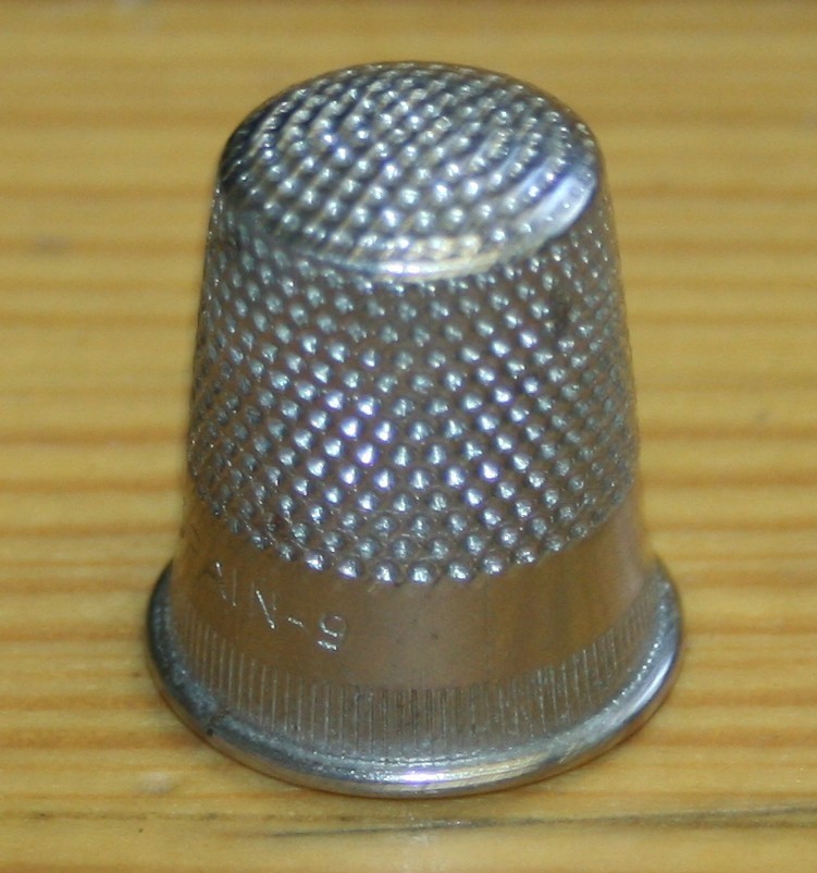 5 VINTAGE THIMBLES SOME SILVER? DONT KNOW