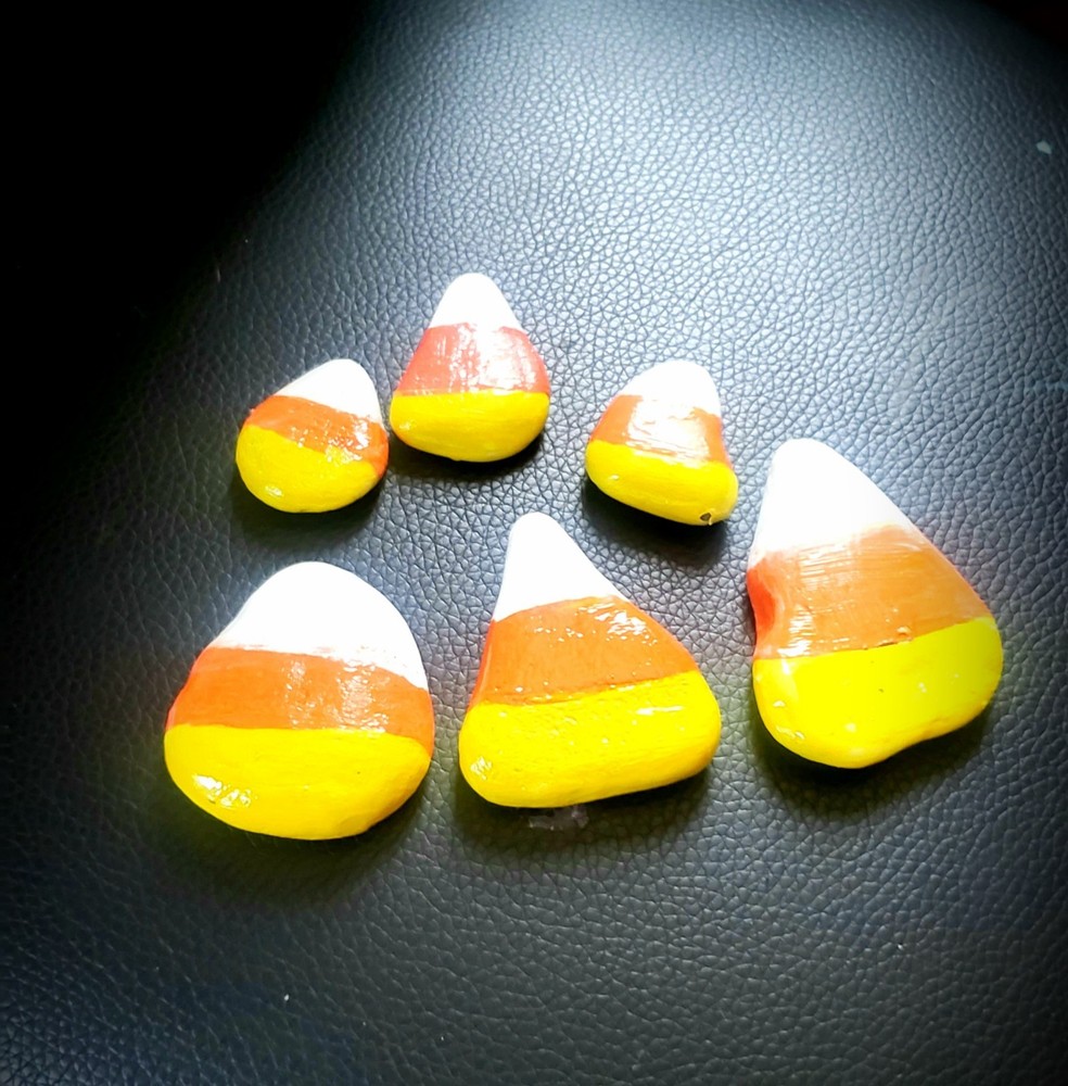 Hand Painted candy corn rocks. Kindness Rocks