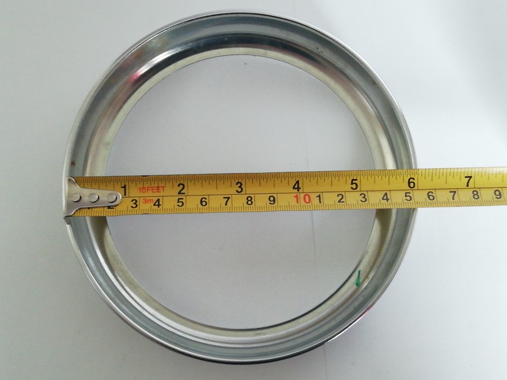 UNUSED MOTORCYCLE HEADLIGHT AND 6" CHROME RIM.