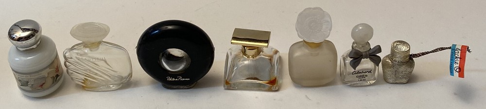 Seven (7) Vintage Perfume Bottles including Jackie O