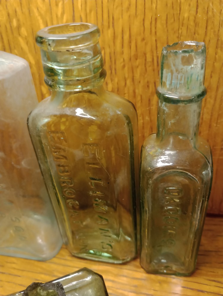 SIX antique bottles