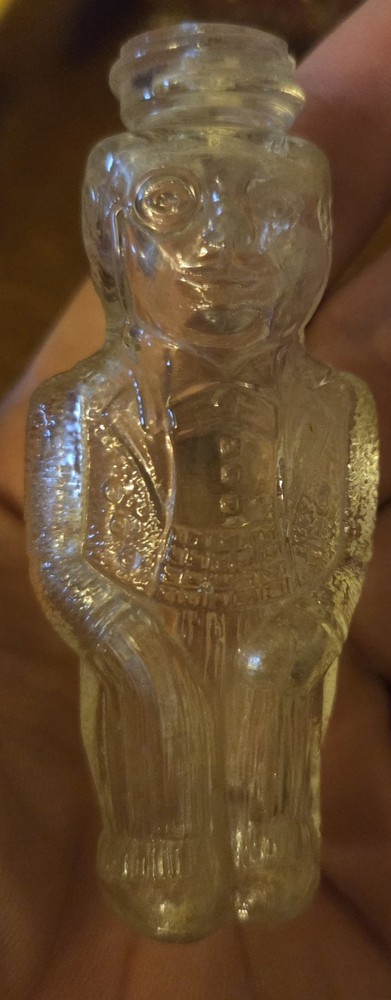 Cute little antique glass Man