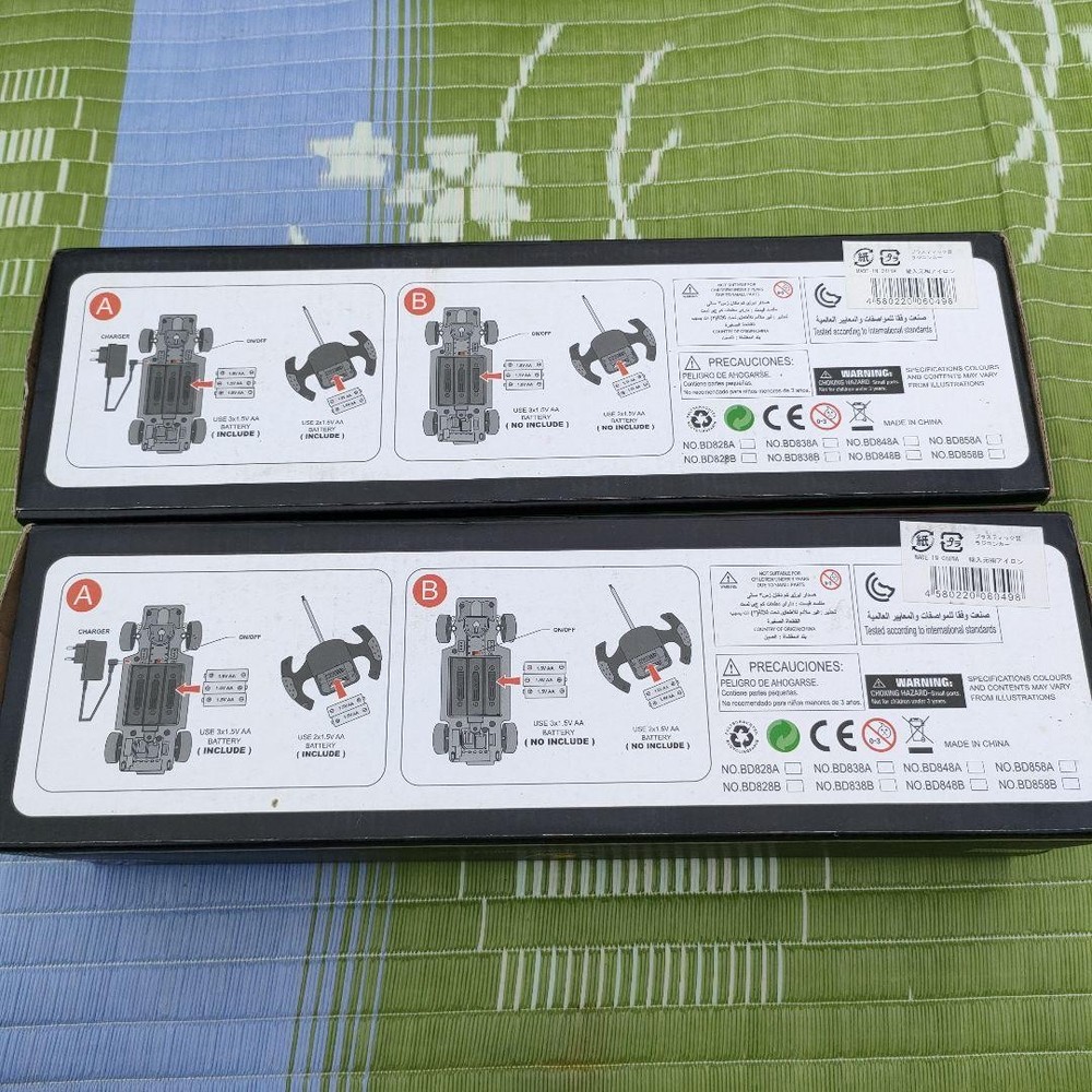 Two plastic radio-controlled cars