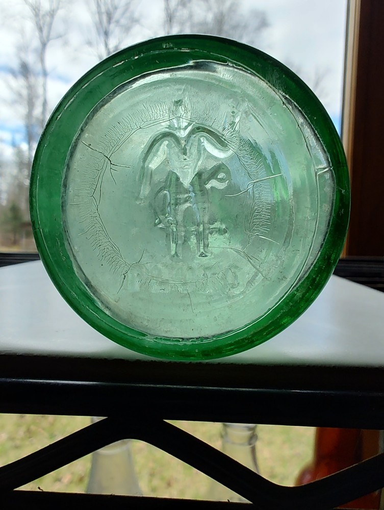 Vintage Pluto Water Bottle America’s Physic Devil Embossed Green