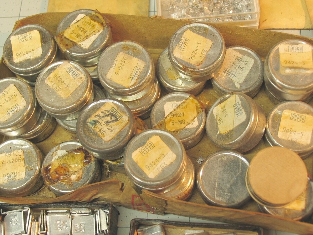 Collection of tiny marked weights 5mg-500mg.