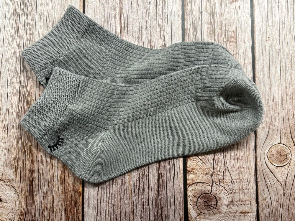 Socks with embroidered lashes