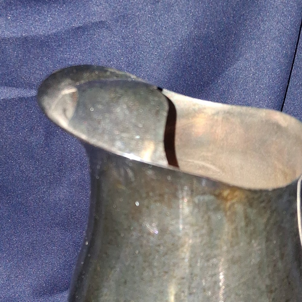 vintage Oneida silver-plated water pitcher.