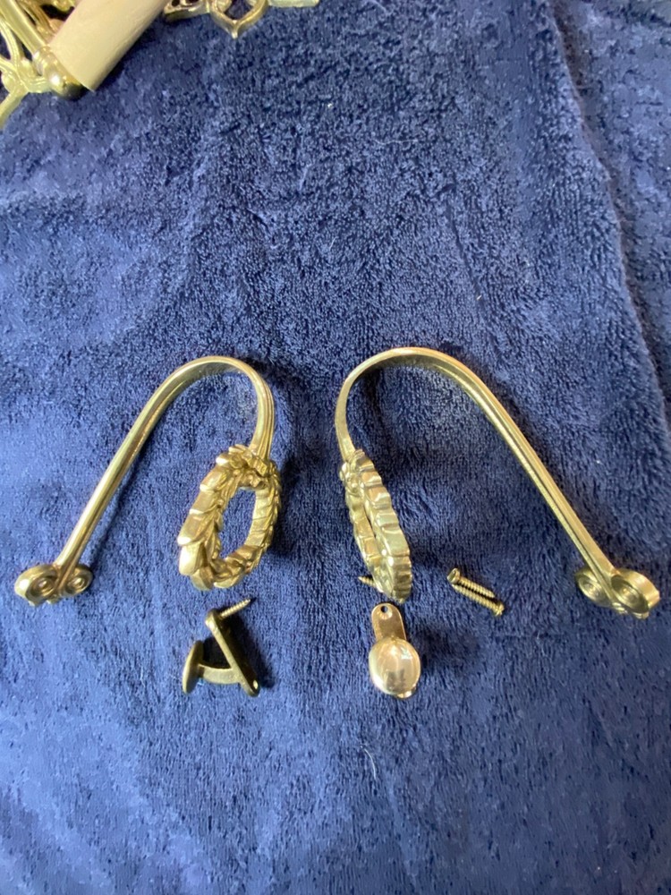 Ornate vintage brass drape tie-backs.