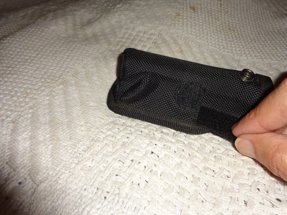black synthetic flash light holder, snap shut holder only not the flash light