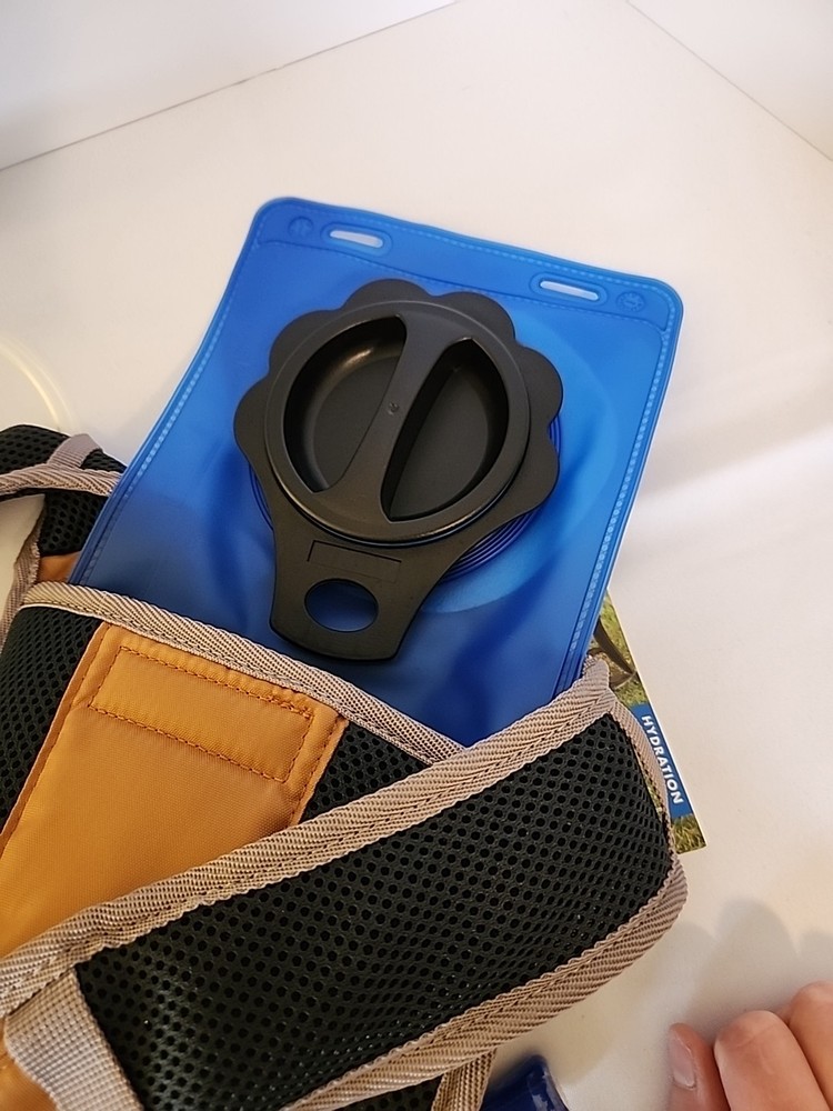 Ozark Trail gold and gray 2 liter hydration pack nwt