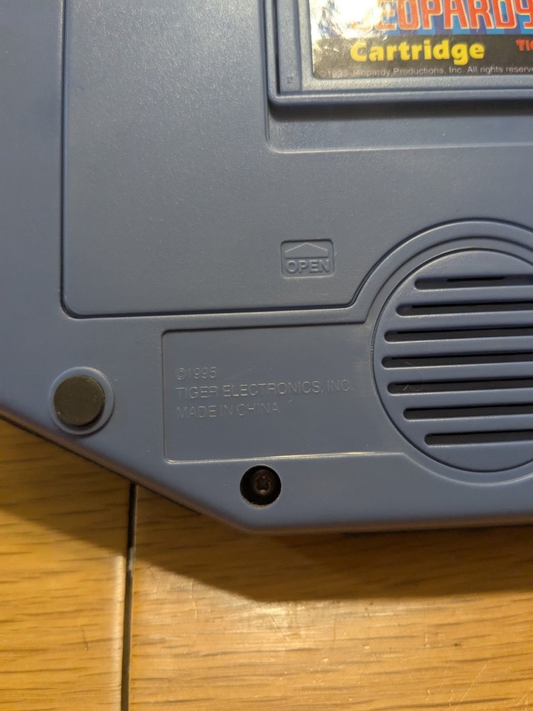 Tiger Electronics Jeopardy Hand Held Game 1995 with Answer Question Book