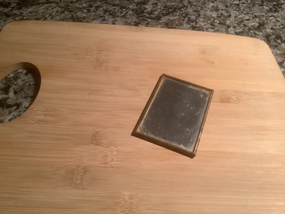 Old pocket mirror…risqué woman…as found
