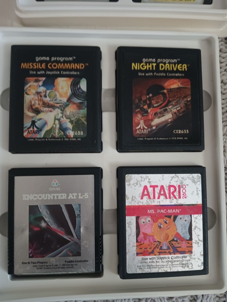 Vintage Atari 2600 Game lot with Atari Original storage cases, untested