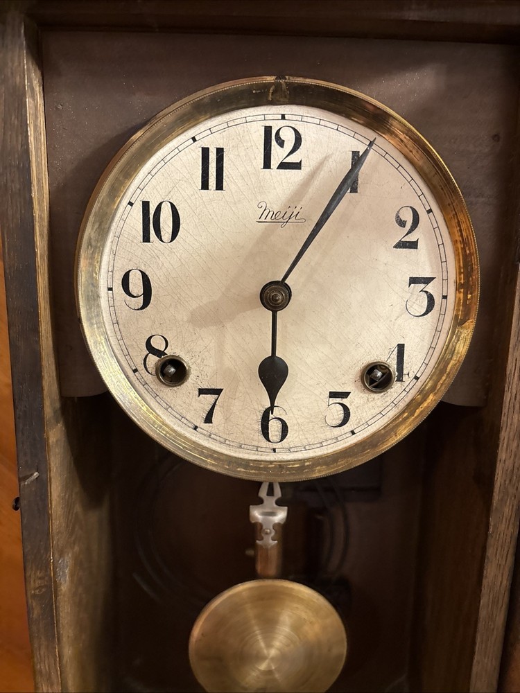 Vintage spring pendulum clock made by Meiji Clock Co.