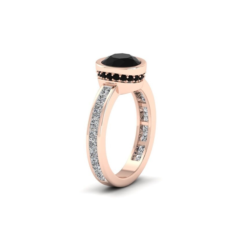Make a statement with this stunning rose gold ring featuring a round black gemst